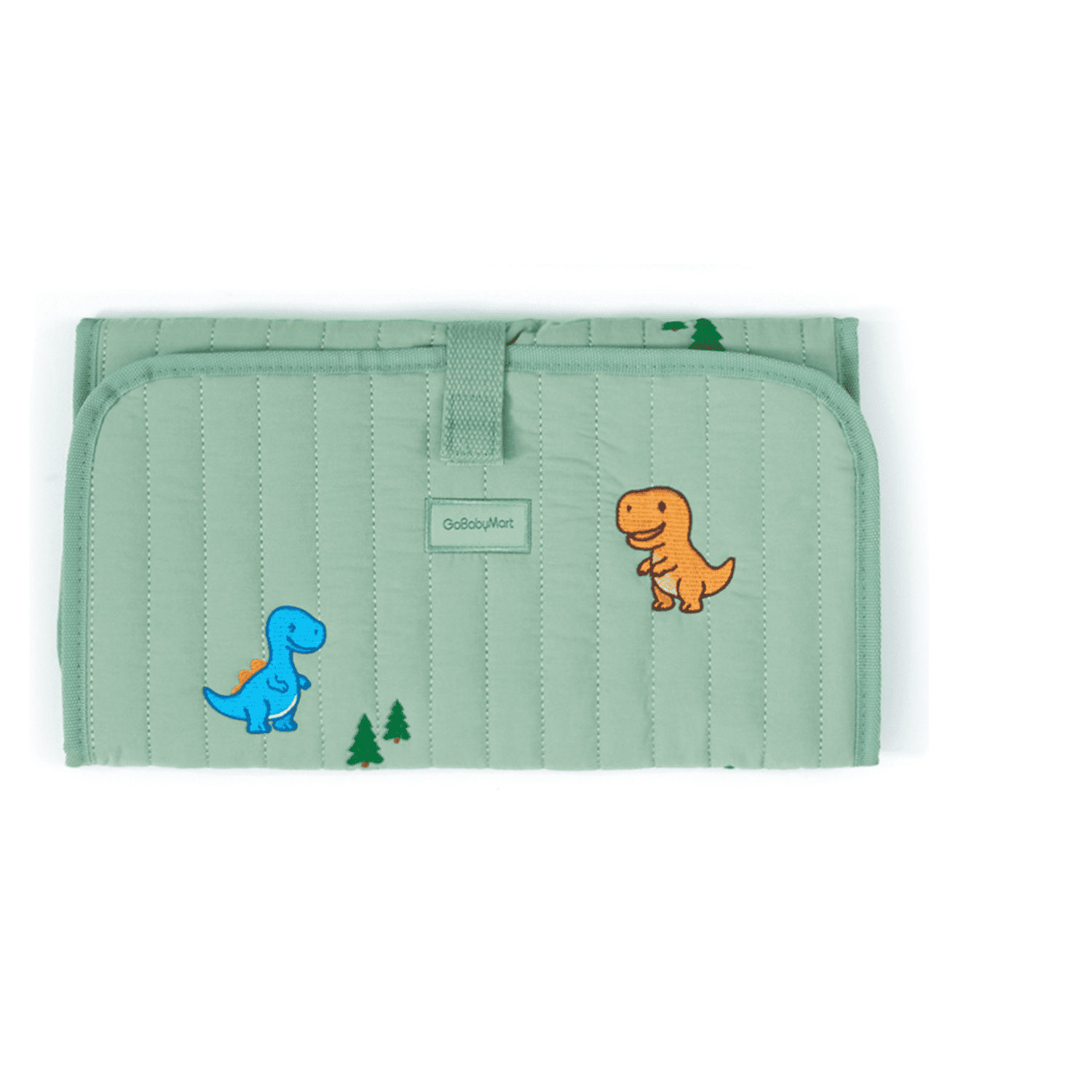 A folded quilted baby changing pad in sage green, featuring embroidered cartoon dinosaurs in blue and orange, along with small green pine trees. A small fabric label reads 'OutdoorArt'.