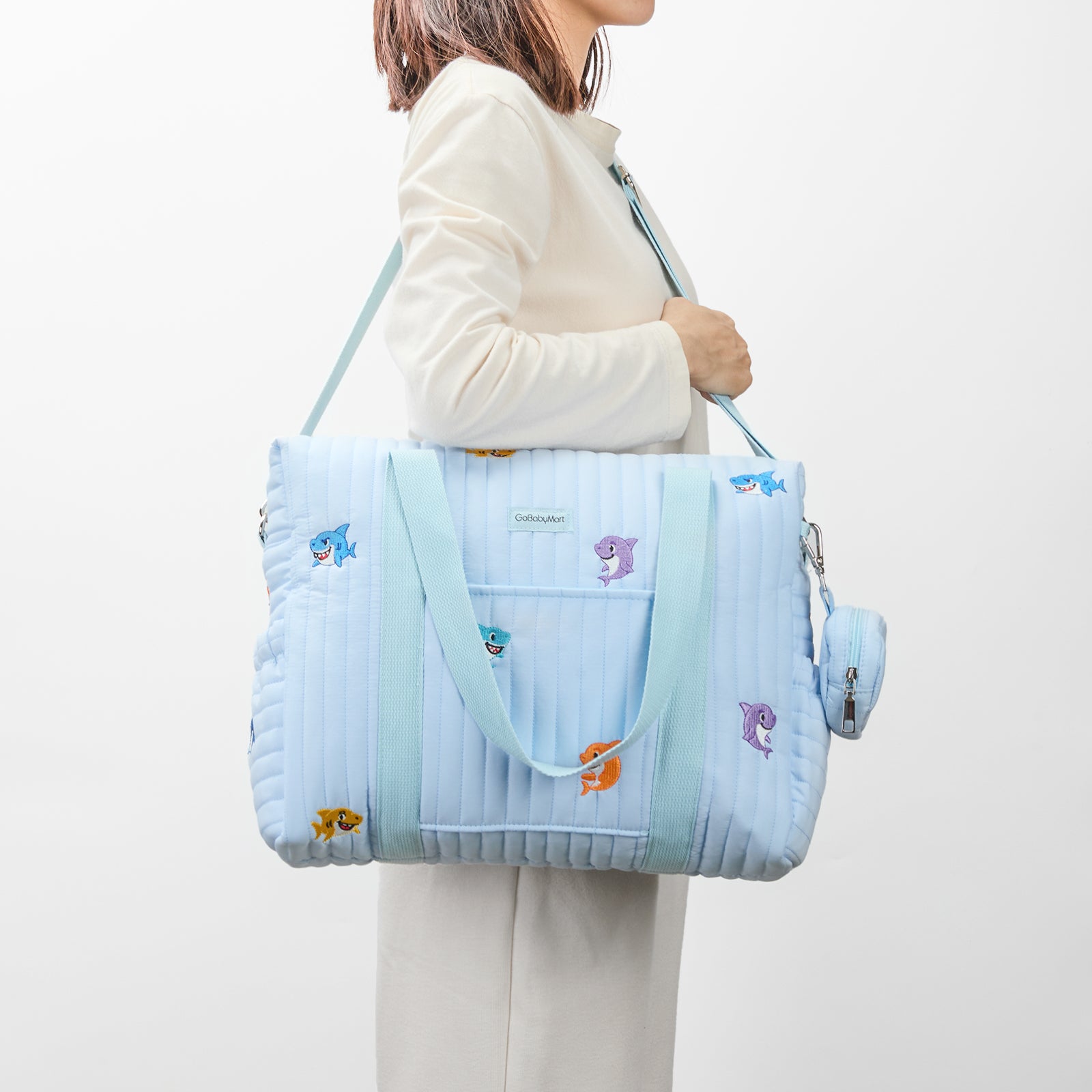 Model wearing diaper bag tote blue sharks #Color_Blue Sharks