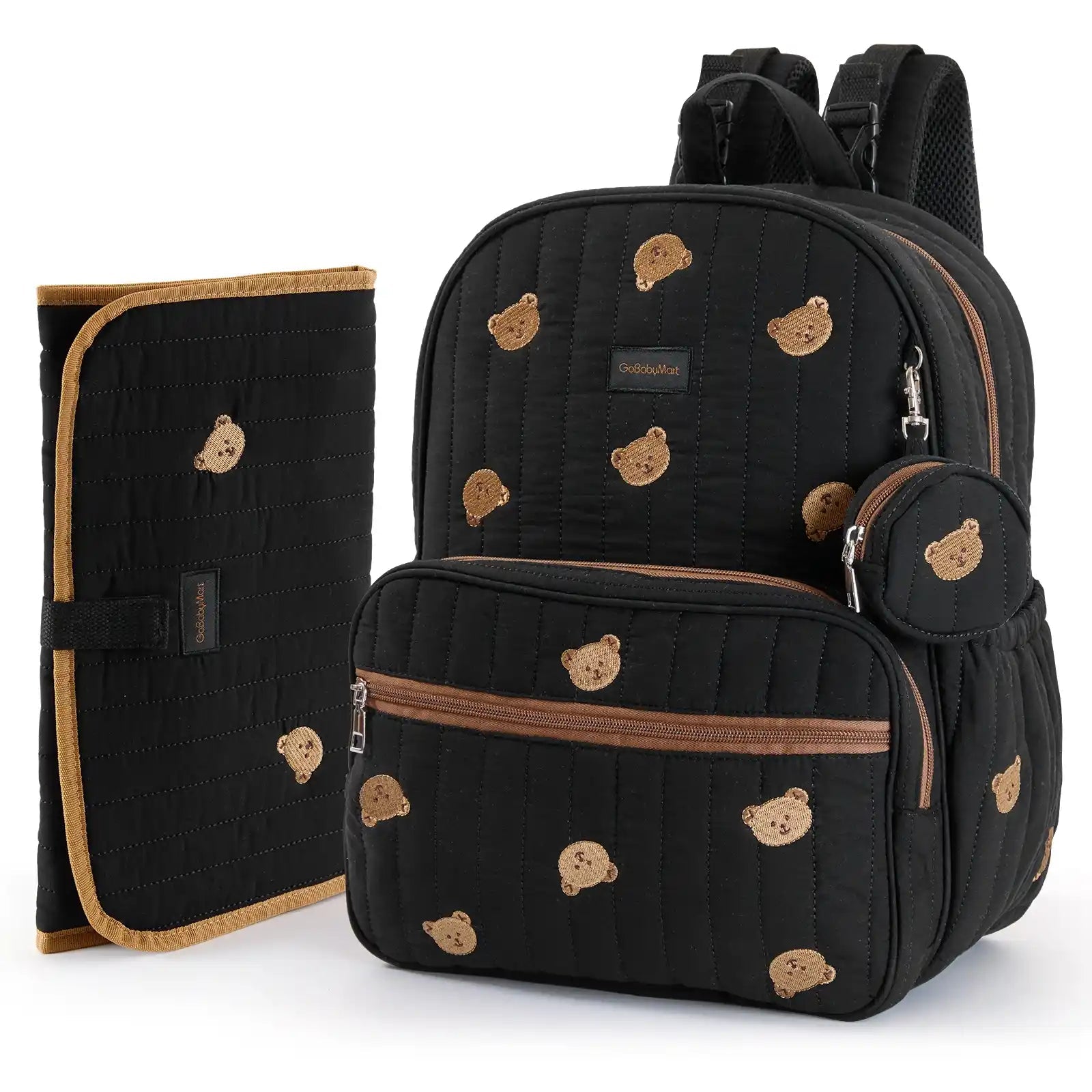A black quilted baby Diaper Bag backpack with a matching zippered pouch and a matching black quilted wrap or mat, both decorated with a tan teddy bear face pattern and brown trim, shown on a white background. #Color_Black - Bears