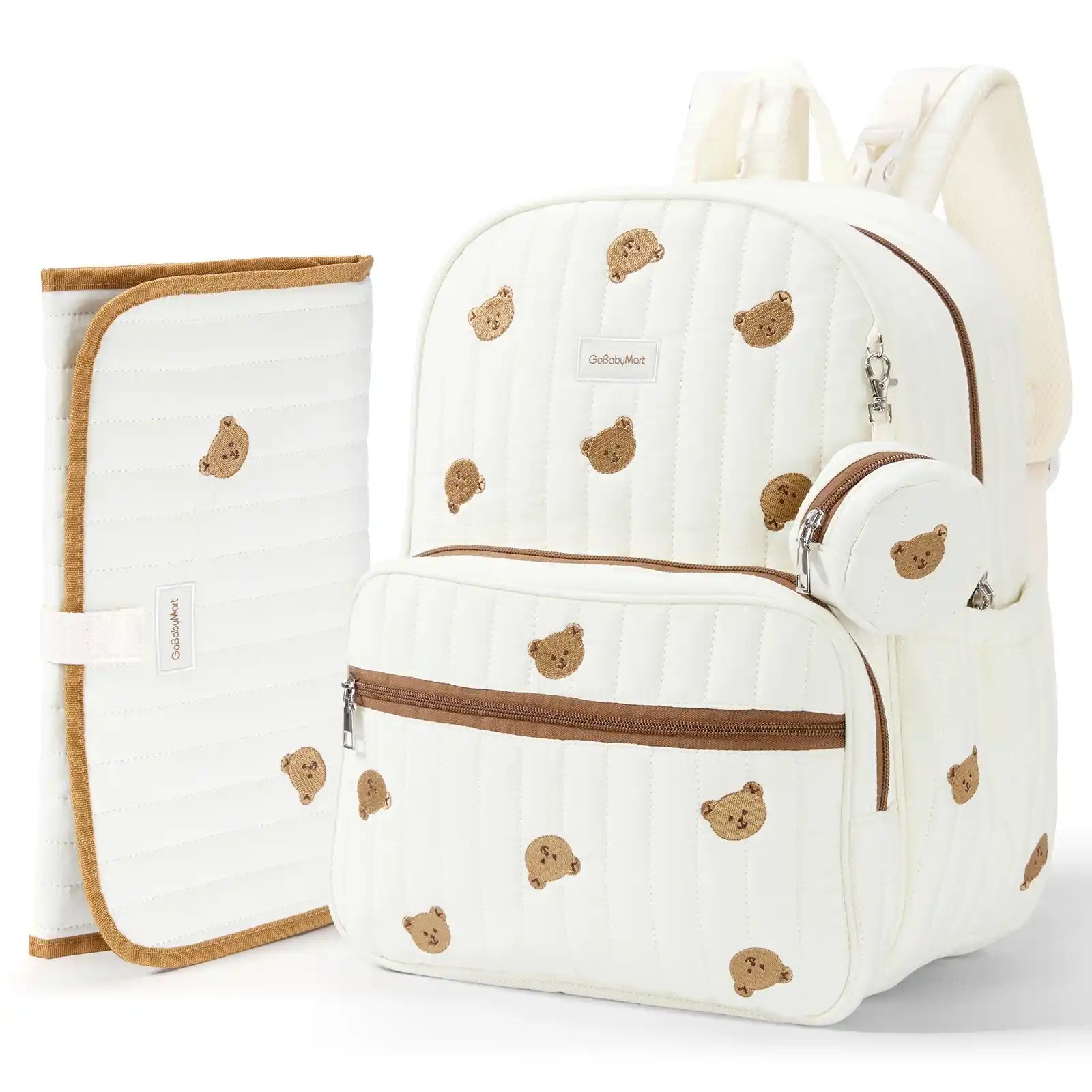 An off-white quilted baby Diaper Bag backpack set with a matching changing pad and small pouch, decorated with a brown teddy bear pattern and brown trim, shown on a white background. #Color_Beige - Bears